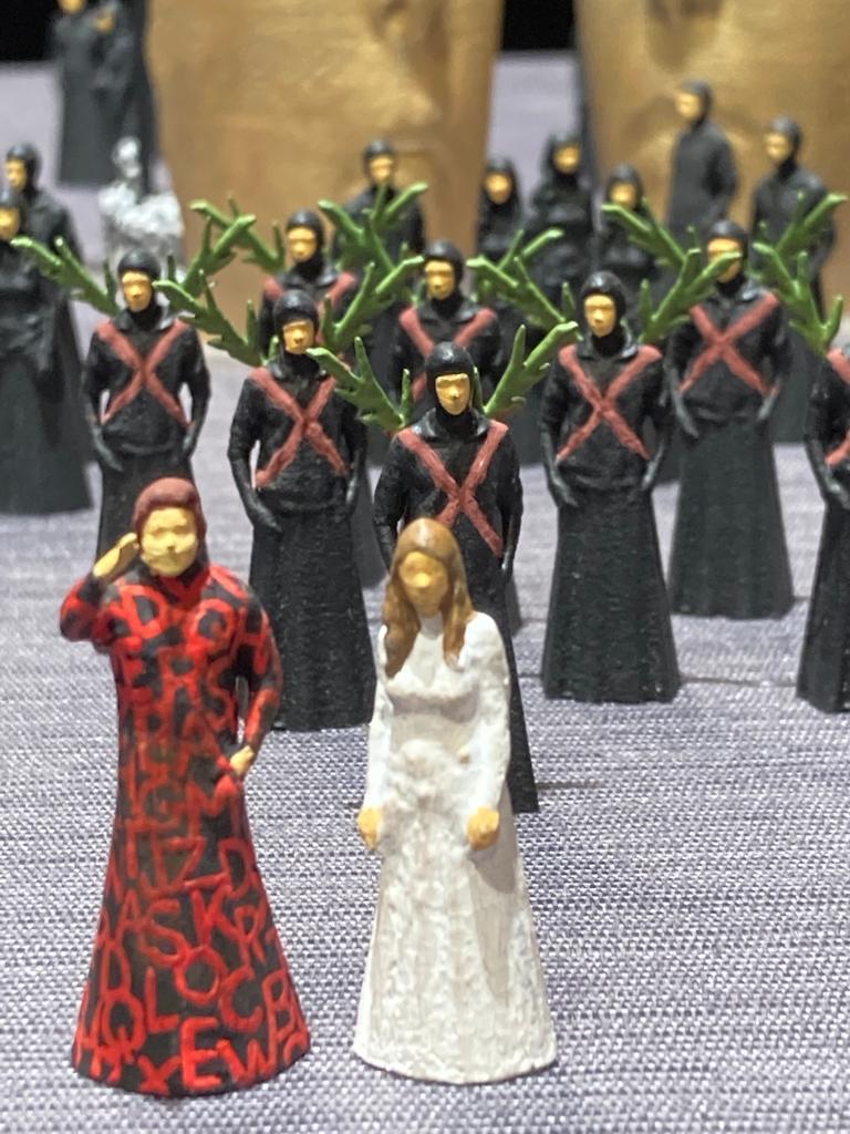 Image of white, black and red figurines